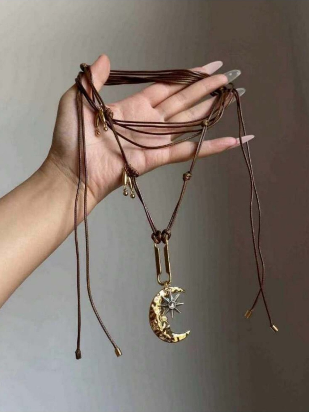 Gold Moon & Star Pendant Necklace in Brown Cord